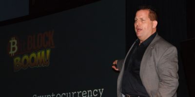 Photo of Ray Redacted Presenting at BitBlockBoom conference